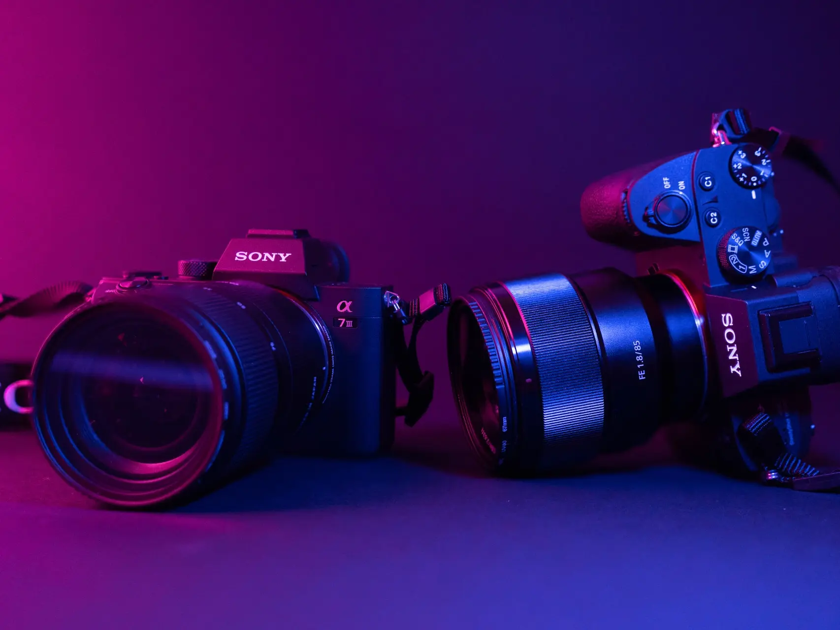 black nikon dslr camera on blue surface